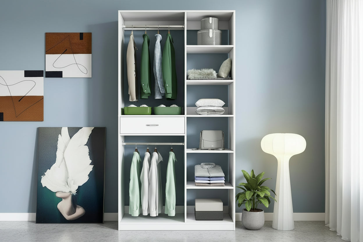 White wardrobe with clothes and storage boxes against a light blue wall.