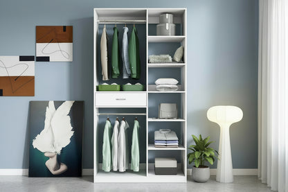 White wardrobe with clothes and storage boxes against a light blue wall.